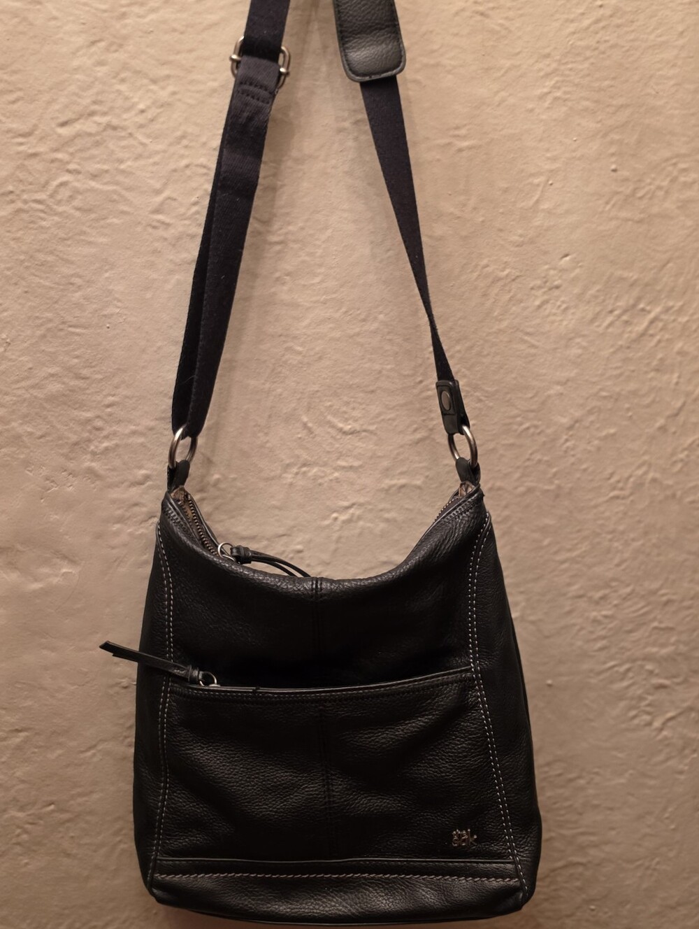 The Sak Black Pebbled Leather Crossbody Bag Botanical Peace Nature Lining